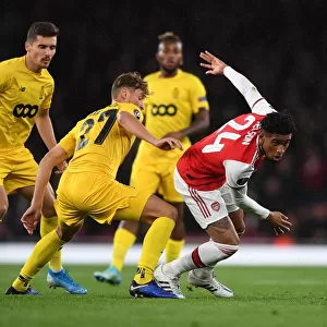 Arsenal's Reiss Nelson Faces Off Against Standard Liege's Mergim Vojvoda in UEFA Europa League Clash