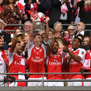 Arsenal's Rob Holding Lifts FA Cup after Arsenal v Chelsea Final Victory