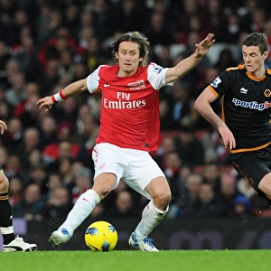 Arsenal's Rosicky Clashes with Hunt and Forde of Wolverhampton Wanderers