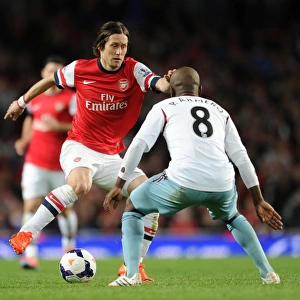 Arsenal's Rosicky Clashes with West Ham's Armero in Premier League Showdown