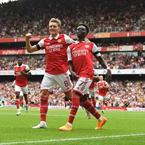 Arsenal's Saka and Odegaard Celebrate First Goal in Emirates Cup Victory