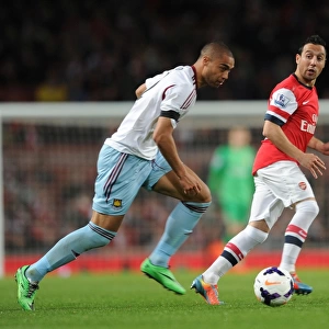 Arsenal's Santi Cazorla Evades Winston Reid's Pressure during Arsenal v West Ham United (2013/14)