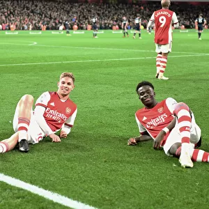 Arsenal's Smith Rowe and Saka Celebrate Goals Against West Ham in Premier League Clash