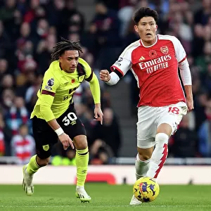 Arsenal's Tomiyasu Fends Off Burnley's Koleosho: Premier League Clash at Emirates Stadium (2023-24)