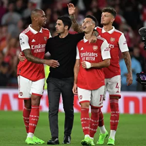 Arsenal's Triumphant Team: Arteta, Gabriel, Martinelli, and Ben White Celebrate Victory over Aston Villa (2022-23)
