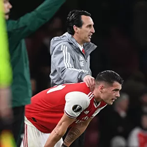 Arsenal's Unai Emery and Granit Xhaka: Leading the Team to Victory against Eintracht Frankfurt in the Europa League