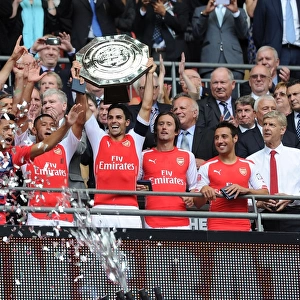 Arsenal's Victory Celebration: Mikel Arteta, Rosicky, Cazorla, Oxlade-Chamberlain, and Wenger at the FA Community Shield 2014/15