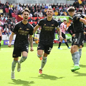 Arsenal's Vieira and Xhaka Celebrate Their Roles in Scoring the Third Goal Against Brentford (2022-23)