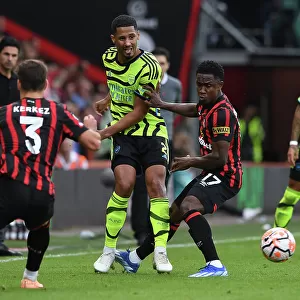 Arsenal's William Saliba Faces Pressure from Bournemouth's Luis Sinisterra in Premier League Clash (AFC Bournemouth vs Arsenal 2023-24)