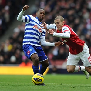 Arsenal's Wilshere Outsmarts Hoilett: Midfield Maestro Dazzles in Arsenal vs. QPR (2012-13 Premier League)
