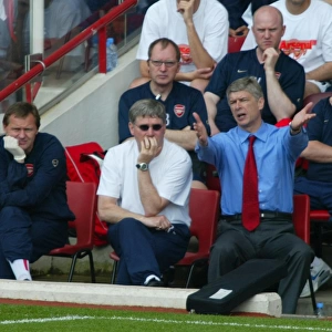 Arsene Wenger the Arsenal manager and Pat Rice his assistant
