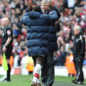Arsene Wenger and Emmanuel Eboue: Celebrating Arsenal's Victory Against Wolverhampton Wanderers, FA Premier League, 2010
