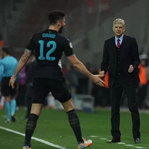 Arsene Wenger and Olivier Giroud: Celebrating Arsenal's Third Goal Against Olympiacos in the Champions League (December 2015)