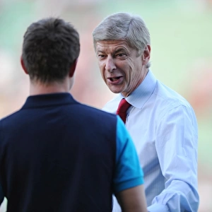 Arsene Wenger's Light-Hearted Moment with Aaron Ramsey during Udinese v Arsenal, UEFA Champions League Play-Off (2011)