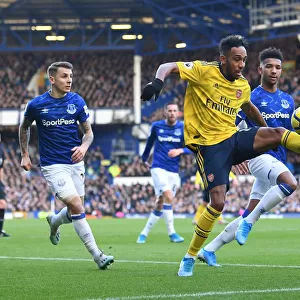 Aubameyang Under Pressure: Everton's Holgate and Digne Harass Arsenal Star