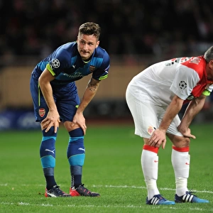 Breathless Moment: Olivier Giroud and Jeremy Toulalan Lock Eyes During Intense Monaco vs. Arsenal UCL Clash