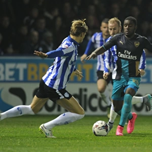 Campbell vs Loovens: A Football Rivalry in the Capital One Cup - Sheffield Wednesday vs Arsenal