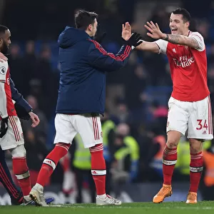 Celebrating Victory: Xhaka and Ozil Reunite in Arsenal's Chelsea Win (2019-20)