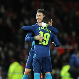 Celebration at Old Trafford: Koscielny and Cazorla Rejoice After Arsenal's FA Cup Victory Over Manchester United