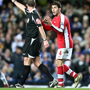 Cesc Fabregas (Arsenal) and Referee Mike Dean