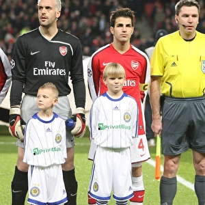 Cesc Fabregas and Manuel Almunia (Arsenal) line up before the match