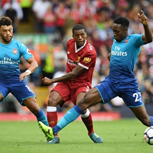 Clash at Anfield: Oxlade-Chamberlain and Welbeck Go Head-to-Head with Wijnaldum