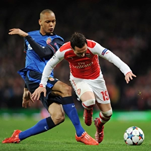 Clash of Midfield Maestros: Santi Cazorla vs Fabinho in Arsenal's UEFA Champions League Battle against AS Monaco