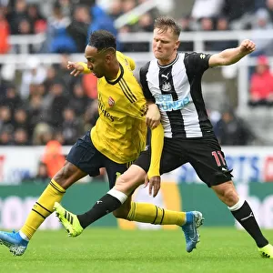 Clash of the Premier League Stars: Aubameyang vs. Ritchie - Arsenal's Star Forward Meets Newcastle's Midfield Maestro