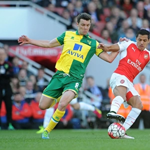 Clash of Stars: Alexis Sanchez vs. Jonny Howson in Arsenal's Battle Against Norwich