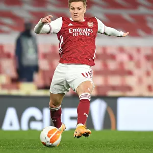 Behind Closed Doors: Martin Odegaard in Europa League Action for Arsenal Against Olympiacos