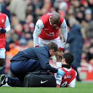 Colin Lewin and Abou Diaby check on the injured Samir Nasri (Arsenal). Arsenal 2