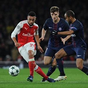 Coquelin Under Fire: Arsenal's Midfielder Battles Meunier and Moura in Intense Arsenal vs. Paris Saint-Germain Champions League Clash