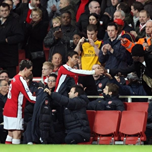 Eduardo (Arsenal) shakes hands with Emmanuel Adebayor