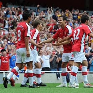 Eduardo celebrates scoring Arsenals 2nd goal with Cesc Fabregas