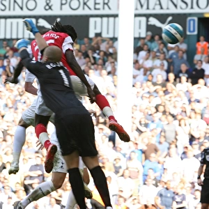 Emmanuel Adebayor heads past Tottenham goalkeeper Paul Robinson to score the 1st Arsenal goal