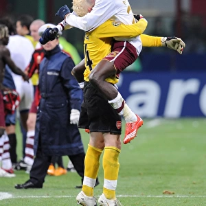 Emmanuel Adebayor and Manuel Almunia celebrate Arsenals victory