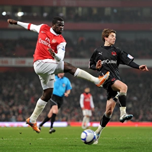 Emmanuel Eboue (Arsenal) Thomas Carroll (Orient). Arsenal 5: 0 Leyton Orient