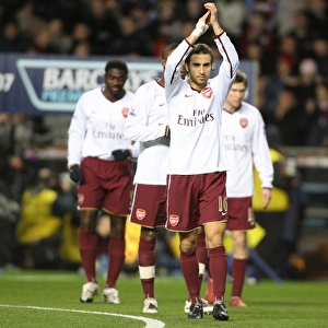 Emmanuel Eboue and Mathieu Flamini applaud the Arsenal fans before the match