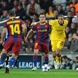 Gael Clichy (Arsenal) takes on Xavi and Pedro Rodriguez (Barcelona). Barcelona 3