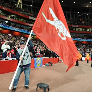 Giant flags are waved pitchside during half time. Arsenal 2: 1 Barcelona