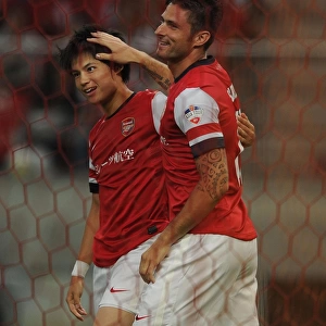 Giroud and Miyaichi Celebrate First Goal for Arsenal in Nagoya Grampus Match, 2013