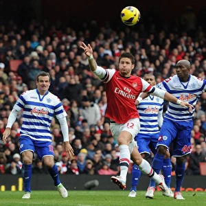 Giroud vs. Mbia: A Premier League Battle – Arsenal's Olivier Giroud and QPR's Stephane Mbia Clash at Emirates Stadium