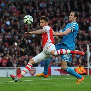 Giroud vs. O'Shea: A Battle of Strength and Determination at Emirates Stadium (Arsenal vs. Sunderland, 2014-15)
