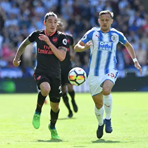 Hector Bellerin vs. Chris Lowe: A Premier League Showdown at Huddersfield