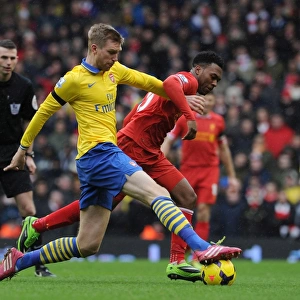 Intense Battle: Per Mertesacker vs. Daniel Sturridge, Premier League 2013-14 - Arsenal's Defender Tackles Liverpool's Striker