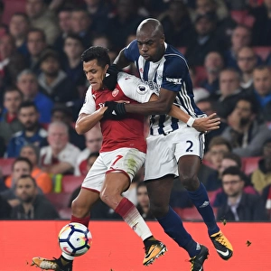 Intense Battle: Sanchez vs. Nyom in Arsenal's Premier League Clash