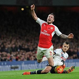 Intense Rivalry: Debuchy Fouls Lamela in Arsenal vs. Tottenham (2015-16)