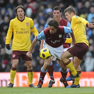 Jack Wilshere (Arsenal) Robert Pires (Villa). Aston Villa 2: 4 Arsenal. Barclays Premier League