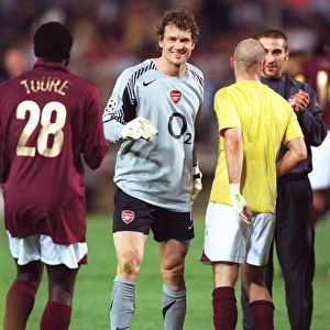 Jens Lehmann (Arsenal) celebrates at the end of the match with Kolo Toure