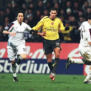 Jeremie Aliadiere breaks past Tal Ben Haim and Idan Tal to set up the 2nd Arsenal goal